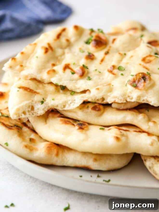 Fire-Kissed Flatbread 9 grilled flatbread torn open so you can see the inside