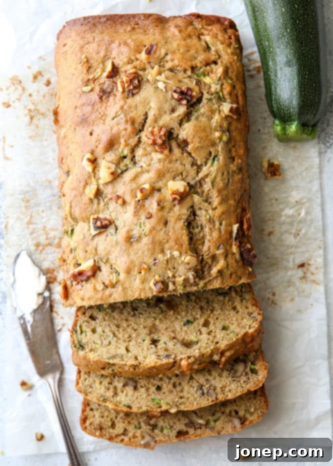 Moist and flavorful banana zucchini walnut bread loaf, perfect for a treat.