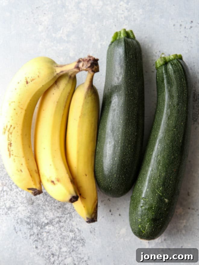 Fresh bananas and shredded zucchini being prepared for the quick bread batter.