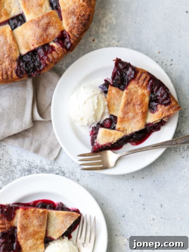 A beautifully rolled out pie crust, gently placed into a ceramic pie dish.