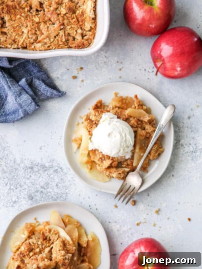 Classic Apple Crisp 2 scoops of apple crisp on plates with ice cream on top