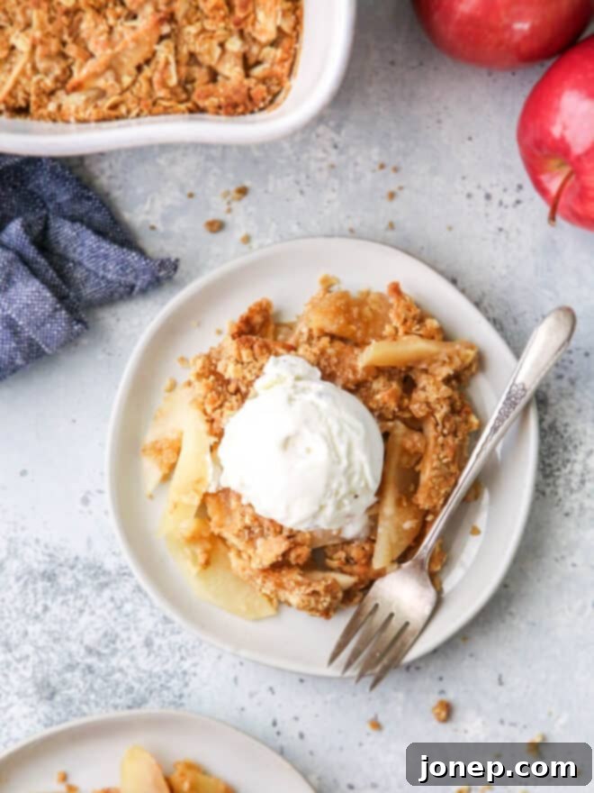 Classic Apple Crisp 7 closeup of apple crisp with ice cream on a plate