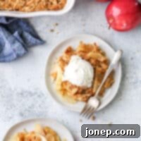 Classic Apple Crisp 8 scoops of apple crisp on plates with ice cream on top