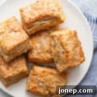 Freshly baked whole wheat cheddar biscuits, golden brown and inviting