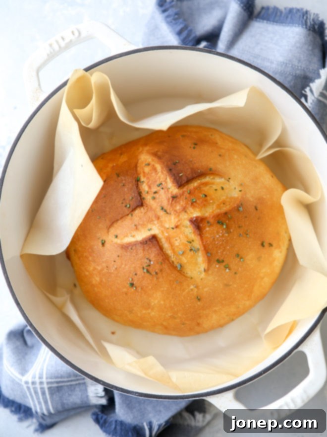 Bake this easy herb bread loaf in your dutch oven for a crispy crust and tender crumb!