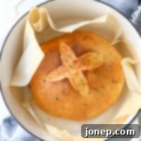 Bake this easy herb bread loaf in your dutch oven for a crispy crust!