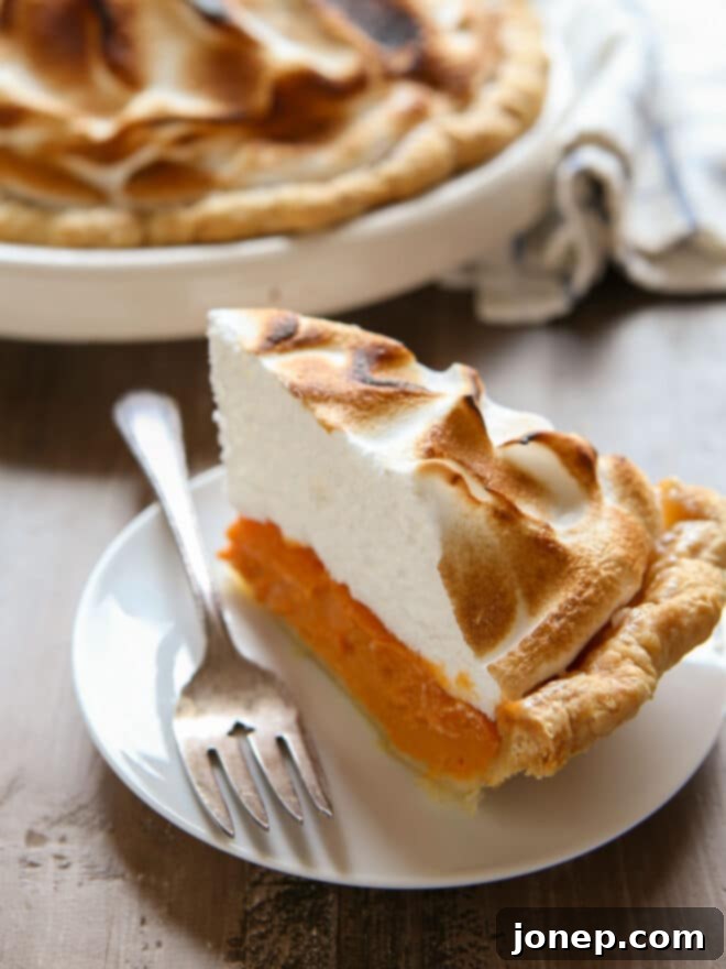 Caramelized Marshmallow Meringue Sweet Potato Pie 2 slice of sweet potato pie on a plate, showcasing the fluffy toasted meringue topping