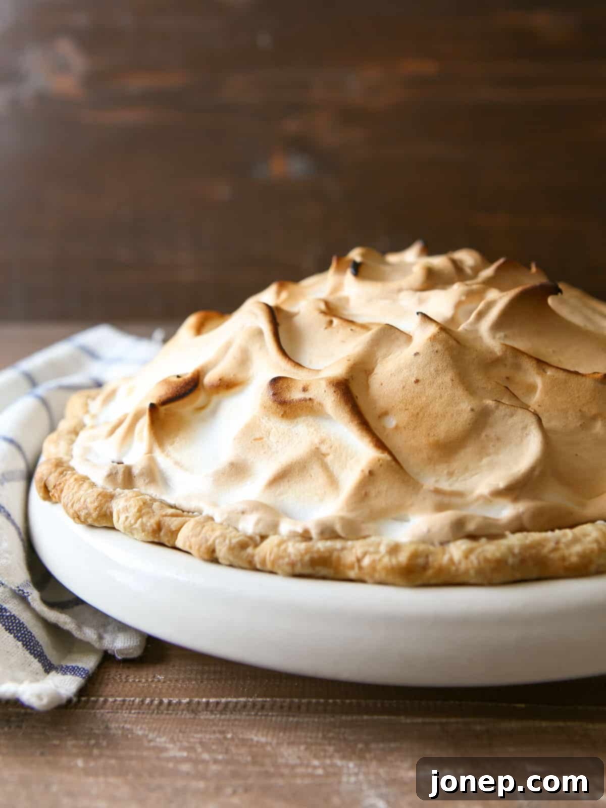 toasted marshmallow meringue generously spread on top of the sweet potato pie