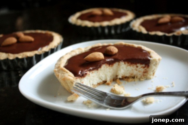 Close-up of a homemade Almond Joy Tart with chocolate and coconut