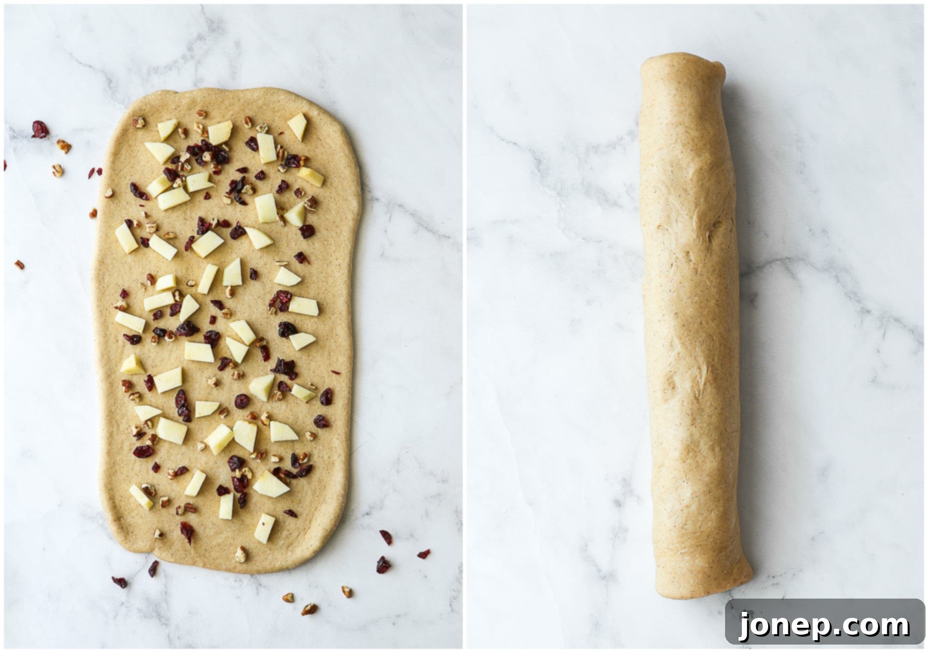 Dough rolled out and topped with chopped apples, dried cranberries, and pecans, then rolled tightly into a log.
