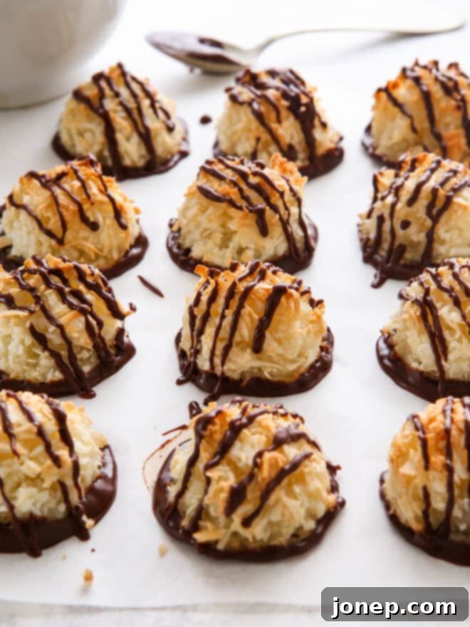dipping coconut macaroons in chocolate