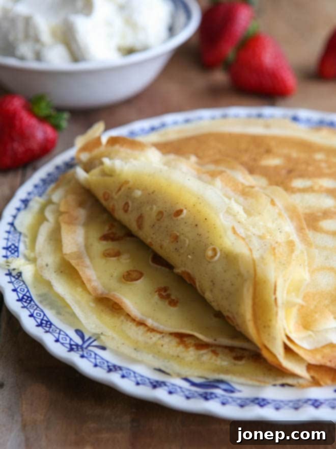Homemade crepes to be served with strawberries and cream