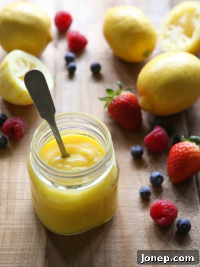 Close-up of a Lemon Berry Shortcake showing layers of tender biscuit, rich lemon curd, and vibrant berries.