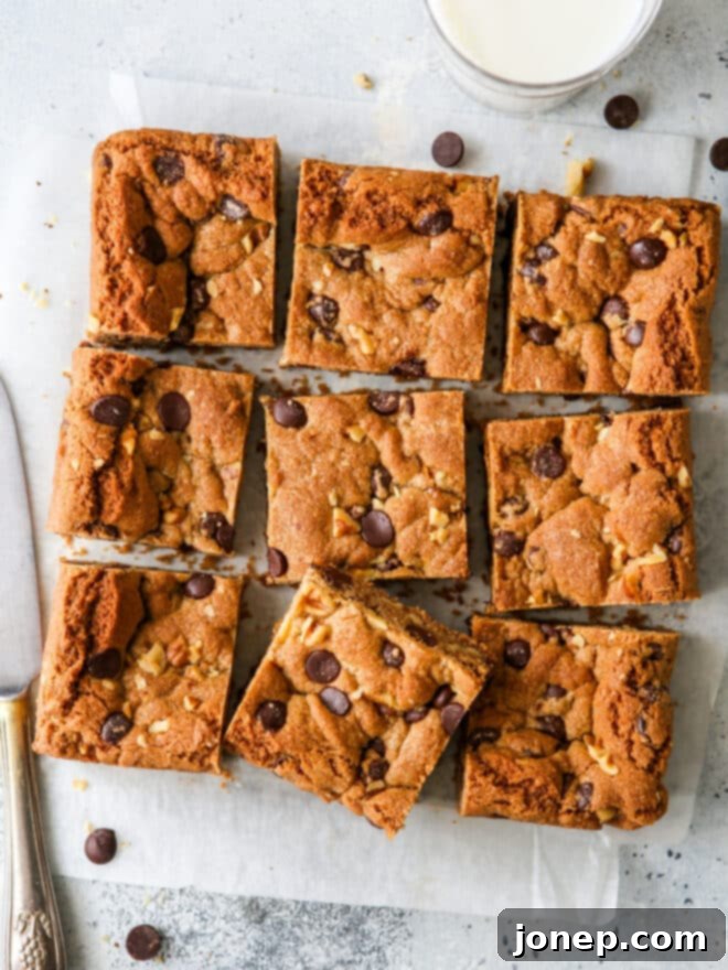 Wholesome Chocolate Chip Cookie Bars 2 Sliced whole wheat chocolate chip cookie bars with a glass of milk, ready to enjoy