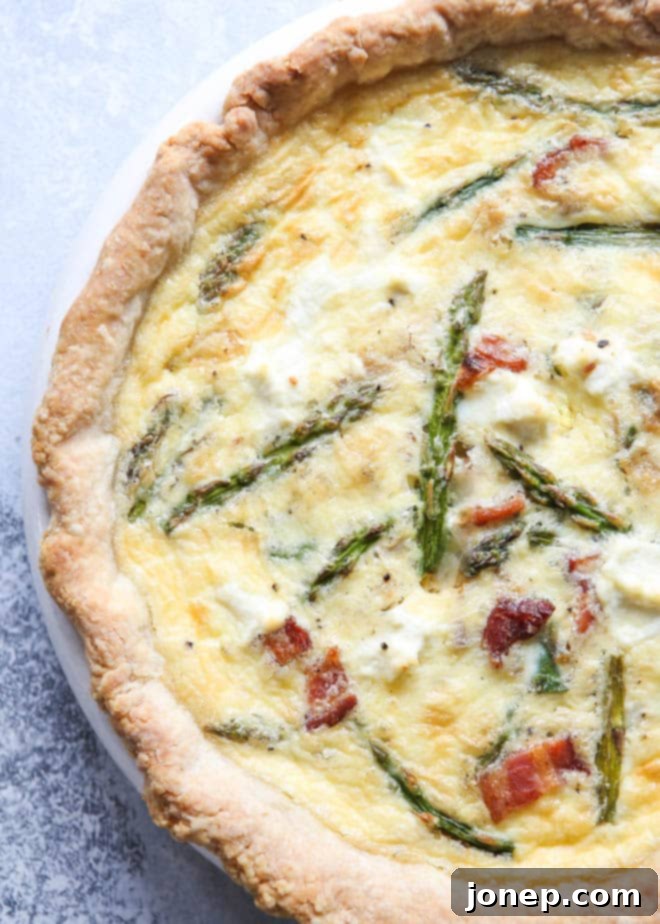 Master Blind Baking for Flawless Pie Crusts 11 A savory asparagus bacon quiche with a golden, cheesy top and a perfectly baked crust, ideal for breakfast or brunch.