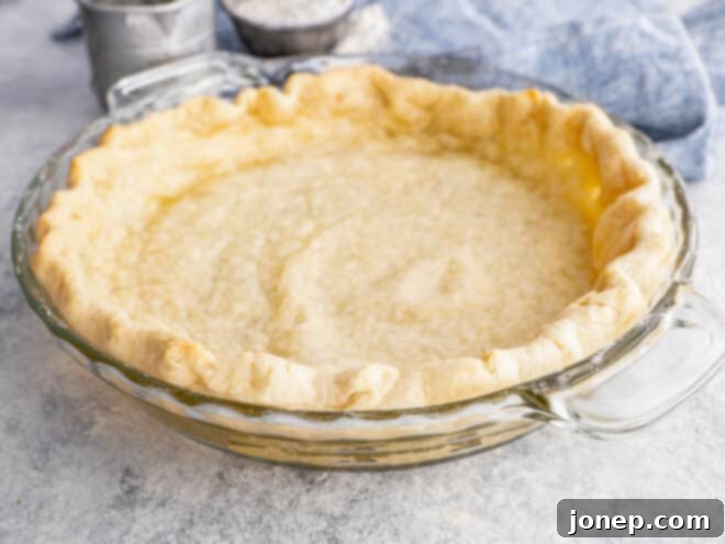 Master Blind Baking for Flawless Pie Crusts 8 A beautifully blind baked pie crust, golden brown and crisp, ready for any sweet or savory filling.