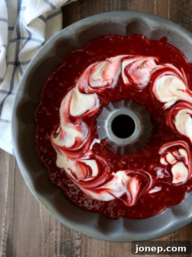 Peppermint Red Velvet Bundt Cake with Cream Cheese Filling and White Chocolate Ganache | completelydelicious.com