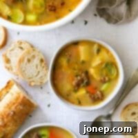 Rustic Italian Sausage & Leek Soup 10 potato leek and italian sausage soup in bowls with crusty bread