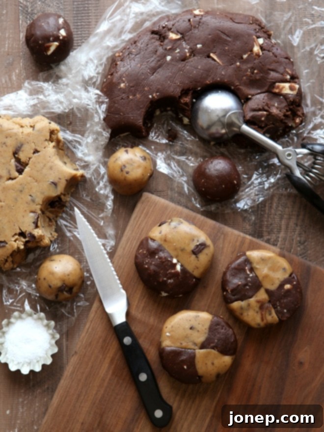 A freshly baked Swirled Malted Chocolate Chip and Reverse Chip Cookie with a perfect golden edge and chewy center.