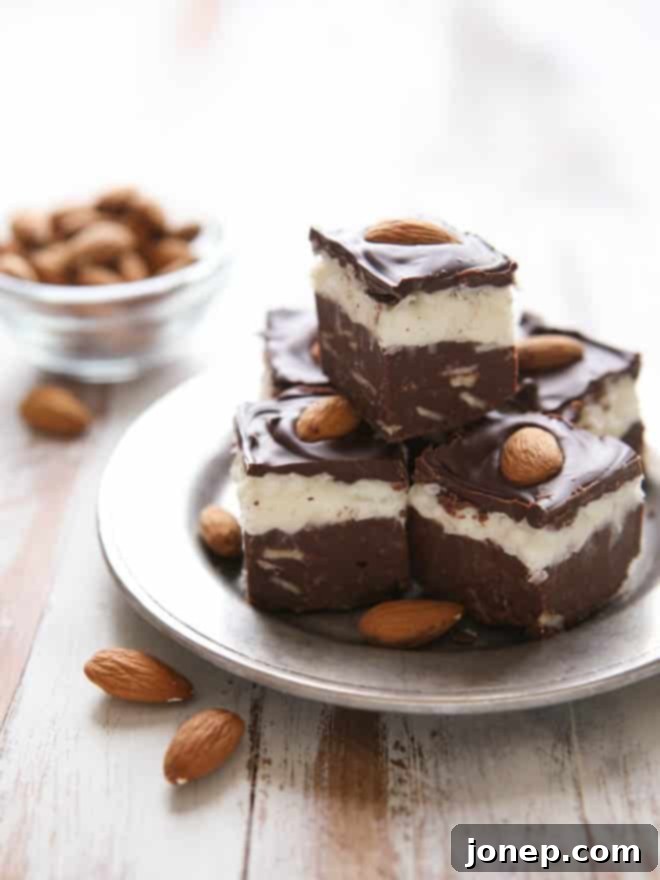 Rich, layered Coconut Almond Fudge with chocolate and almonds, a perfect no-bake dessert