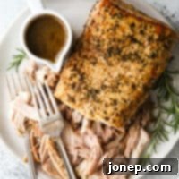 Fragrant Rosemary Balsamic Slow Cooker Pork 7 slow cooker rosemary balsamic pork roast shredded on a plate