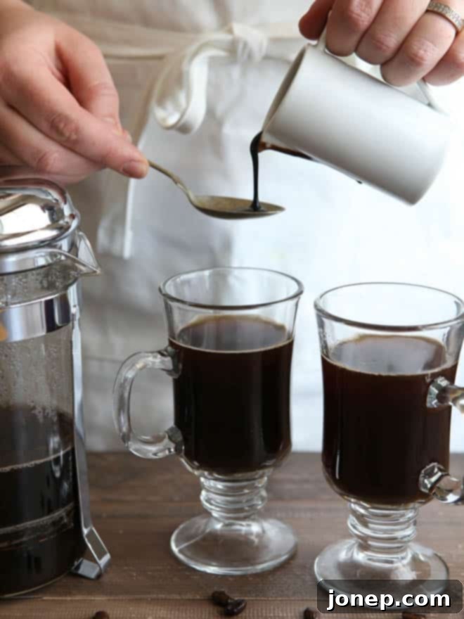 Stirring in coffee liqueur and chocolate syrup for the mocha