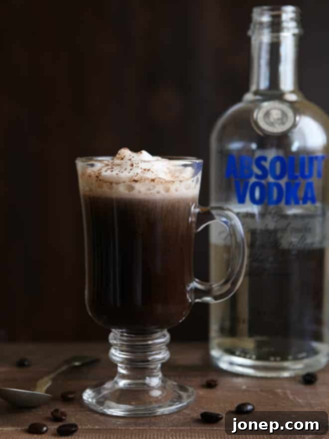 Multiple White Russian Mochas with garnishes on a wooden tray