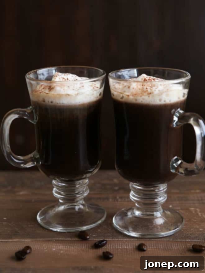A White Russian Mocha with beautiful frothed milk and cocoa powder