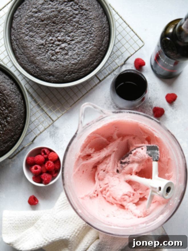 Close-up of the delicate, handcrafted swirls of Raspberry Buttercream on top of the Red Wine Chocolate Cake