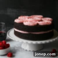 Red Wine Chocolate Cake with Raspberry Buttercream, beautifully frosted and garnished