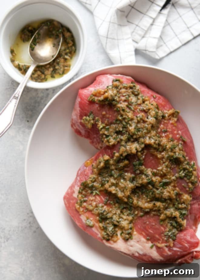 marinating tri-tip roast with garlic and herbs