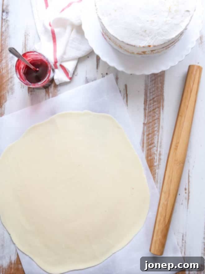 Princess Cake - sponge cake with vanilla and raspberry filling covered with marzipan | completelydelicious.com