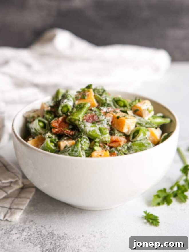 Luscious Creamy Sugar Snap Pea and Bacon Salad 6 creamy sugar snap pea salad with bacon and cheddar in a bowl