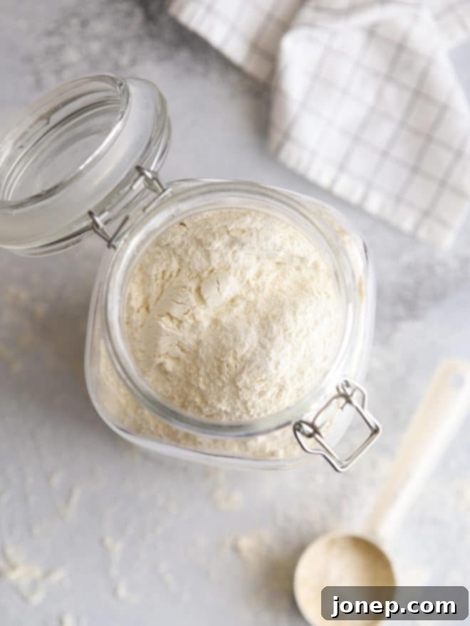 homemade buttermilk pancake mix stored neatly in a clear glass jar