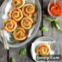 Margherita Pizza Wheels with fresh tomato, basil, and mozzarella.