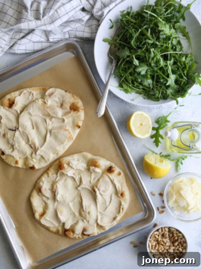 Close-up of fresh pea shoots and arugula for Hummus and Salad Flatbread Pizza