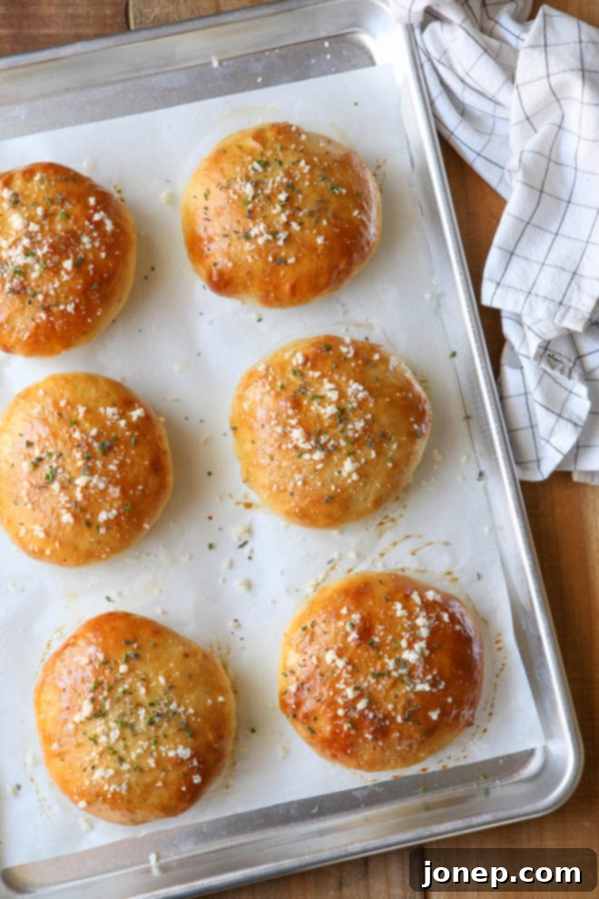 Homemade cheesy herb burger buns elevate any cookout!