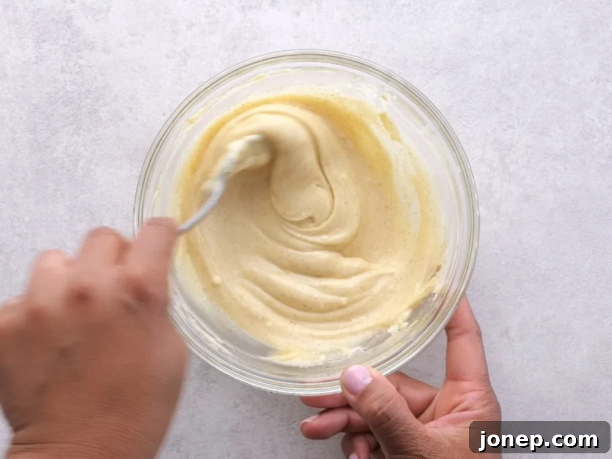 mixing cheesecake filling
