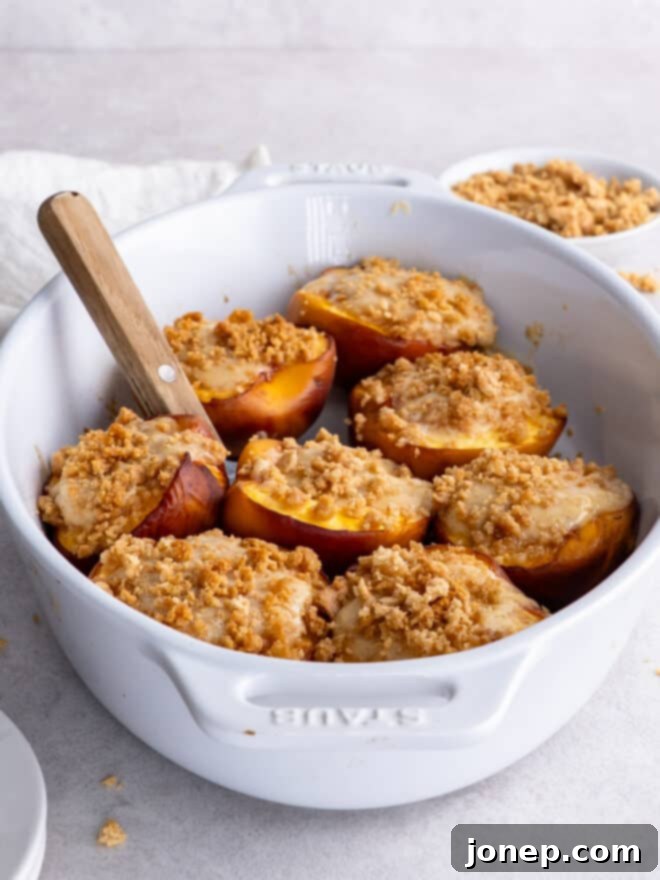 Peaches & Cream Cheesecake Crumble 8 baked cheesecake stuffed peaches in baking dish