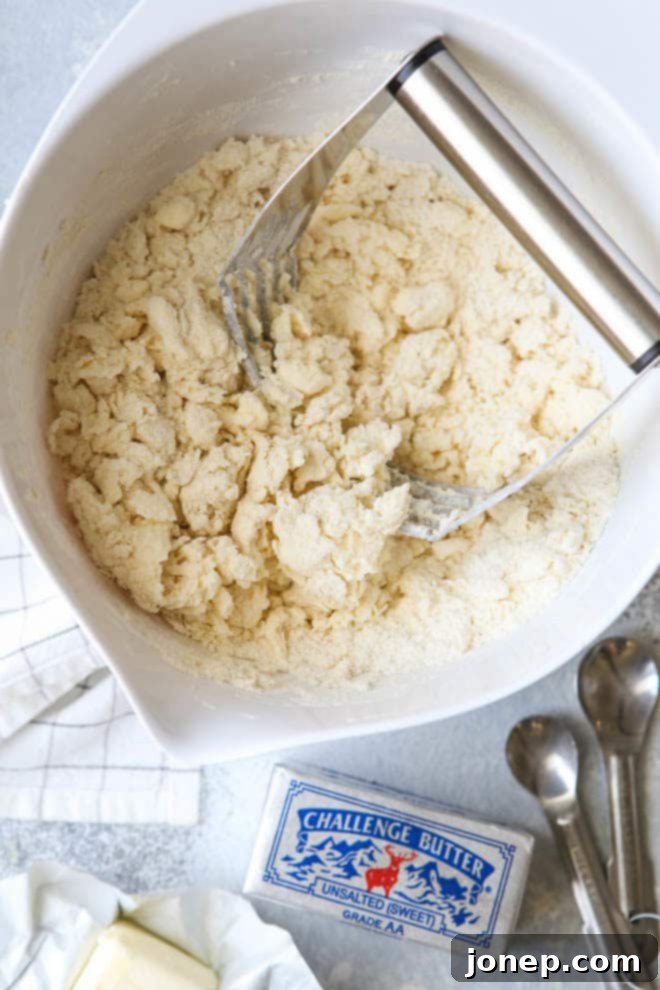 Freshly baked buttermilk biscuits, golden and fluffy, crafted with premium Challenge Butter
