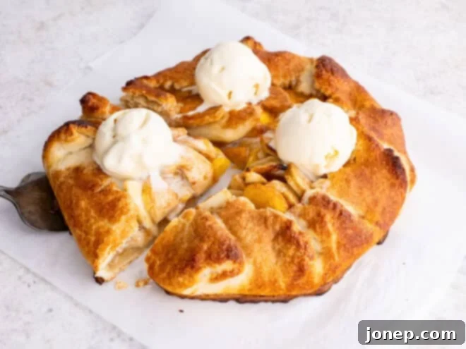 Golden Peach Apple Delight 3 peach apple galette with ice cream scoops on top