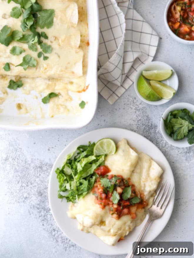 These sour cream chicken enchiladas are a family favorite! They're cheesy, creamy, and made completely from-scratch!