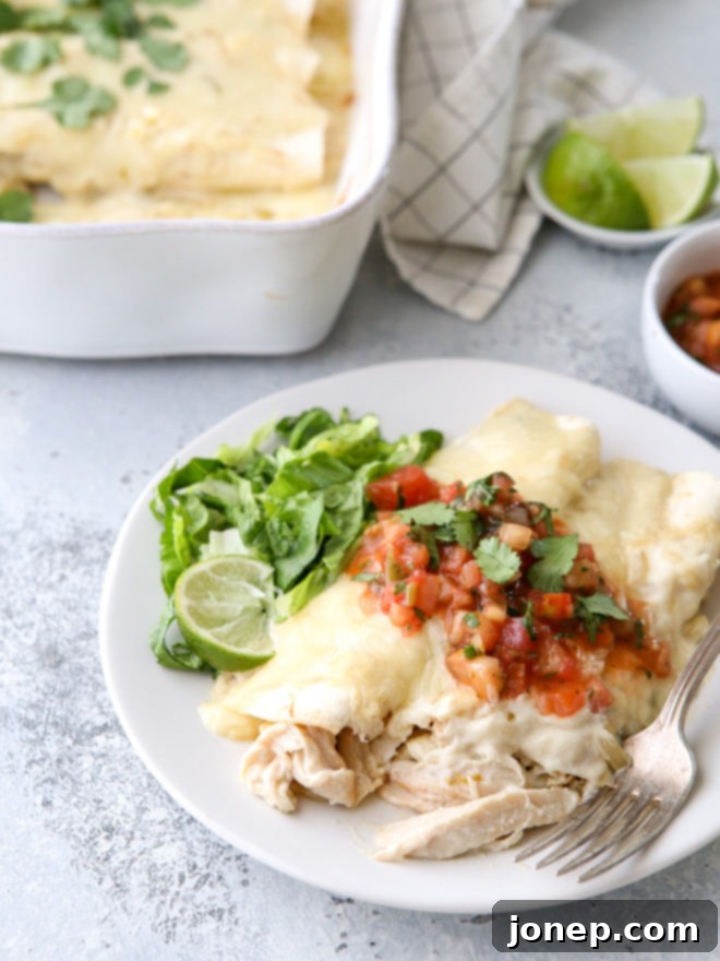 These sour cream chicken enchiladas are a family favorite! They're cheesy, creamy, and made completely from-scratch!