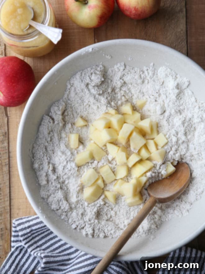 Close-up of freshly baked apple cinnamon scones, showing texture and apple chunks