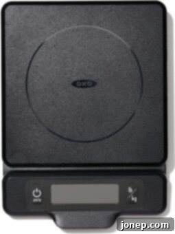 A digital kitchen scale, showing precise measurements in grams for accurate baking.