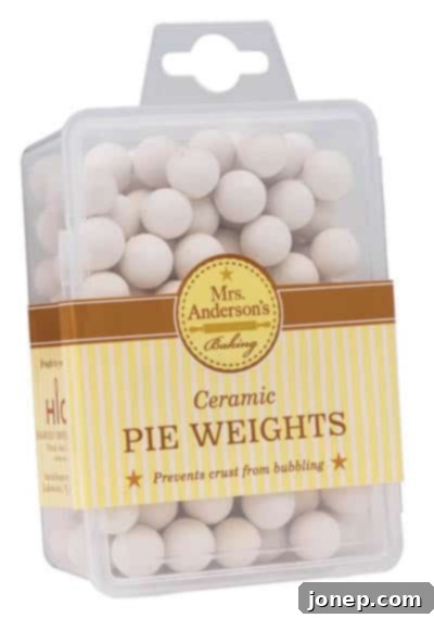 A collection of ceramic pie weights, used for blind baking pie crusts.