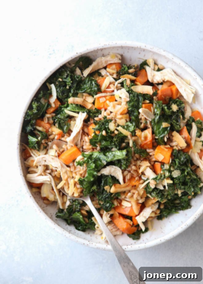 This farro bowl with chicken, kale and sweet potatoes is one of my favorite healthy meals!