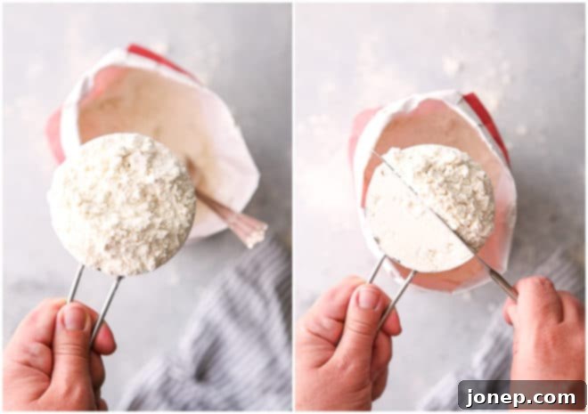 Bake Instagram-Worthy Cookies 5 A measuring cup being filled with flour using a spoon, and then excess flour being leveled off with a knife for accurate measurement.