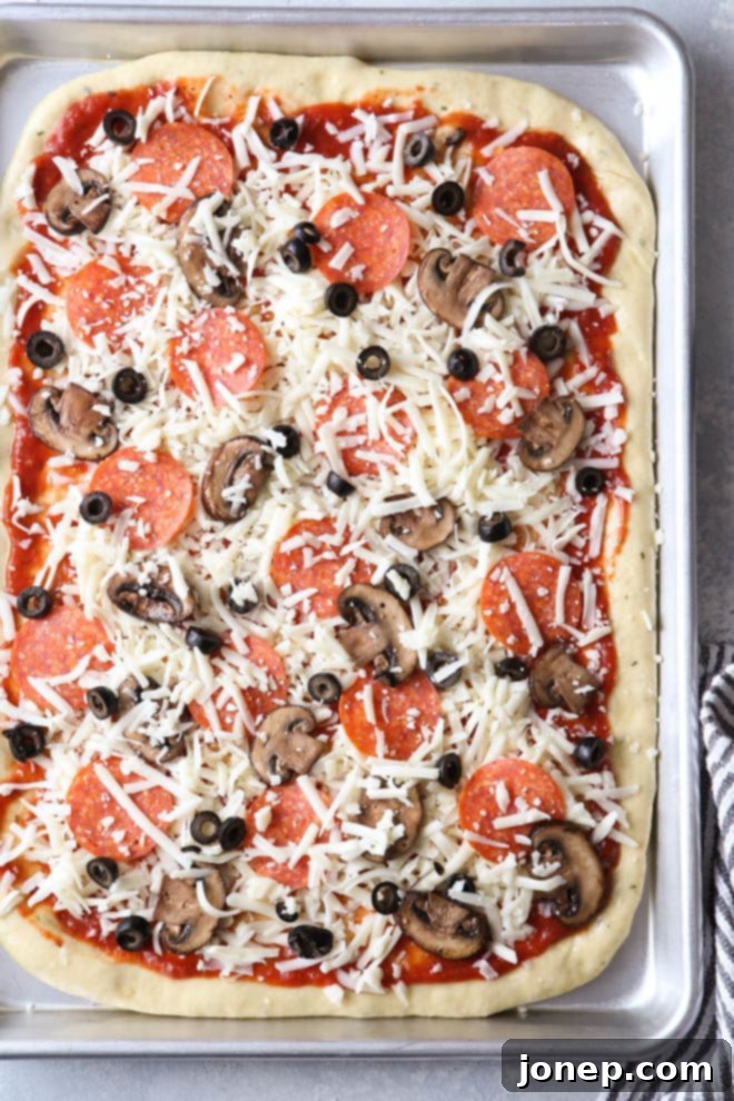 Close-up of homemade pizza dough being rolled out