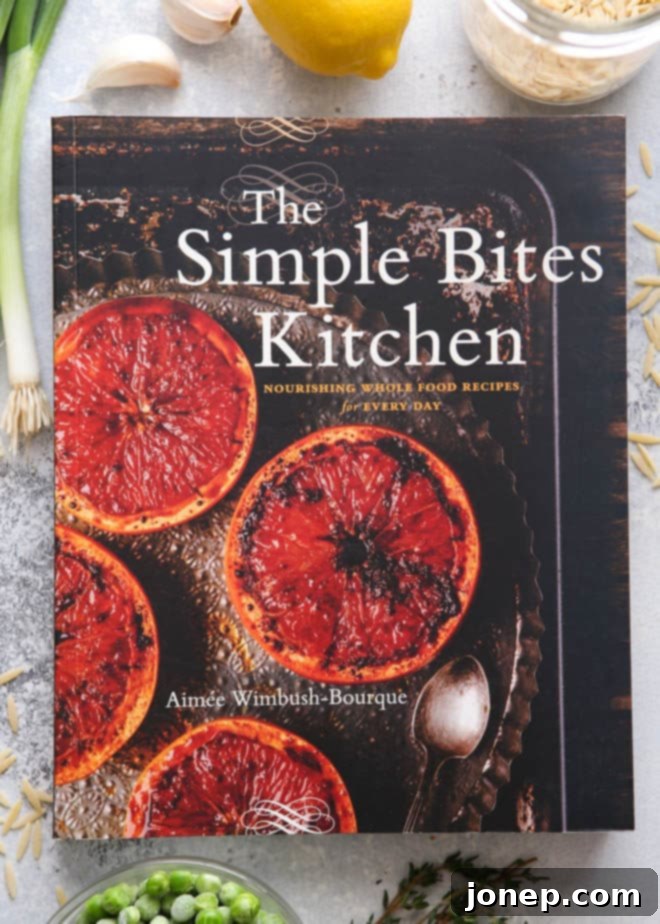 Close-up of the cover of The Simple Bites Kitchen cookbook by Aimée Wimbush-Bourque, showcasing wholesome recipes.